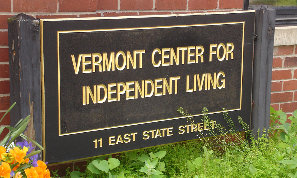 The VCIL exterior sign is large and brown with gold lettering.
