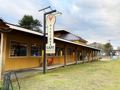 The exterior of Red Hen bakery with a large sign and porch.
