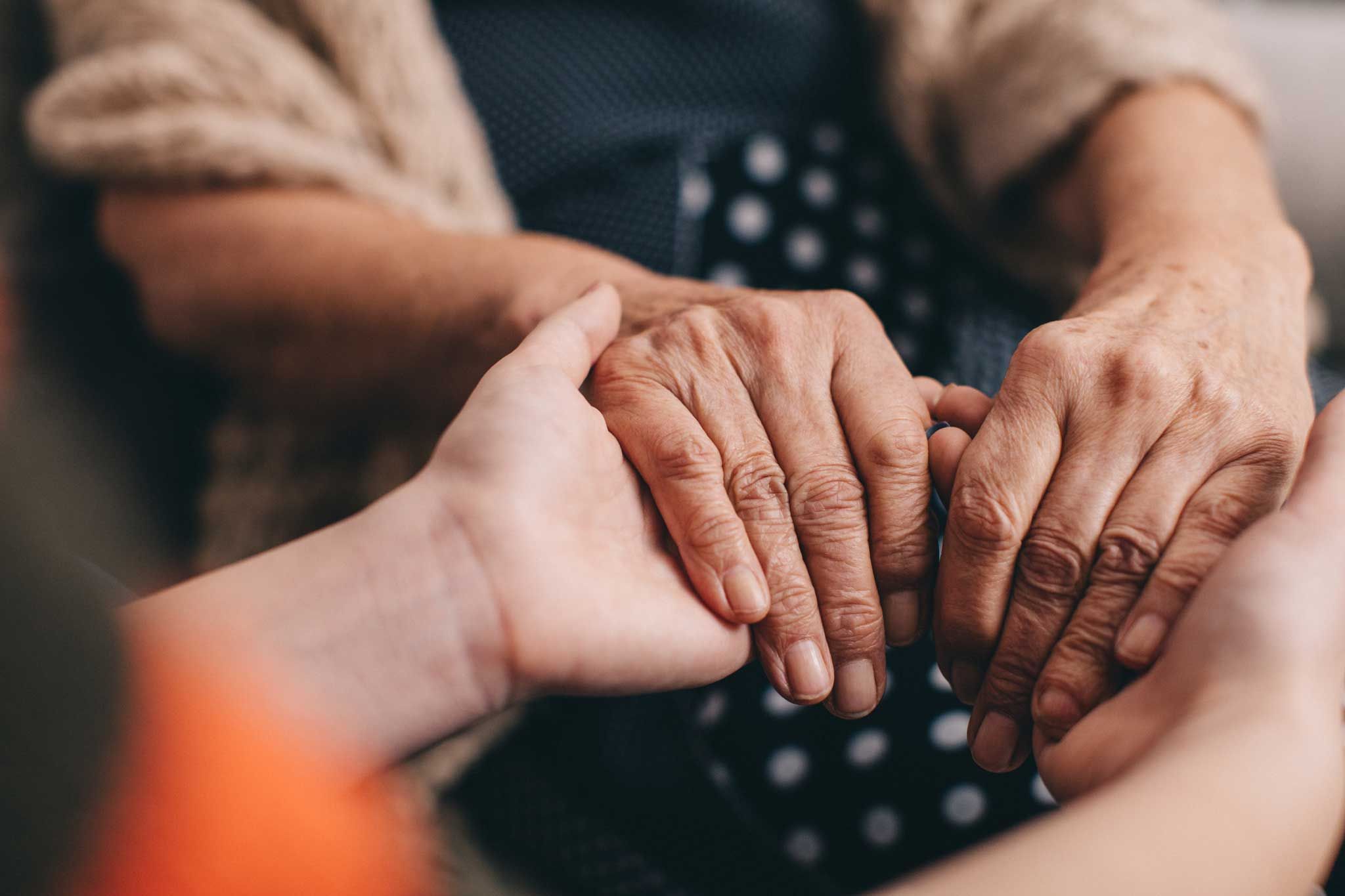 Two people holding hands
